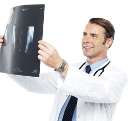 Experienced orthopedic surgeon reviewing x-ray report