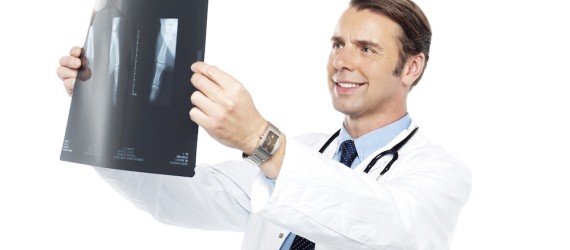 Experienced orthopedic surgeon reviewing x-ray report